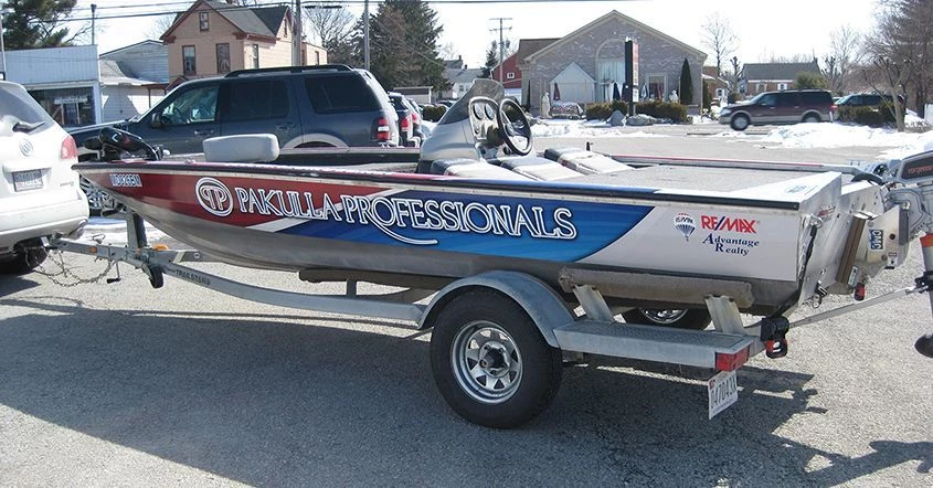 Signs Now Hanover designed, printed and installed this boat wrap for Reservoir Boat Works custom all electric boat.